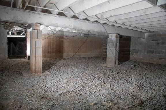 Crawlspace before encapsulation — damp and moldy